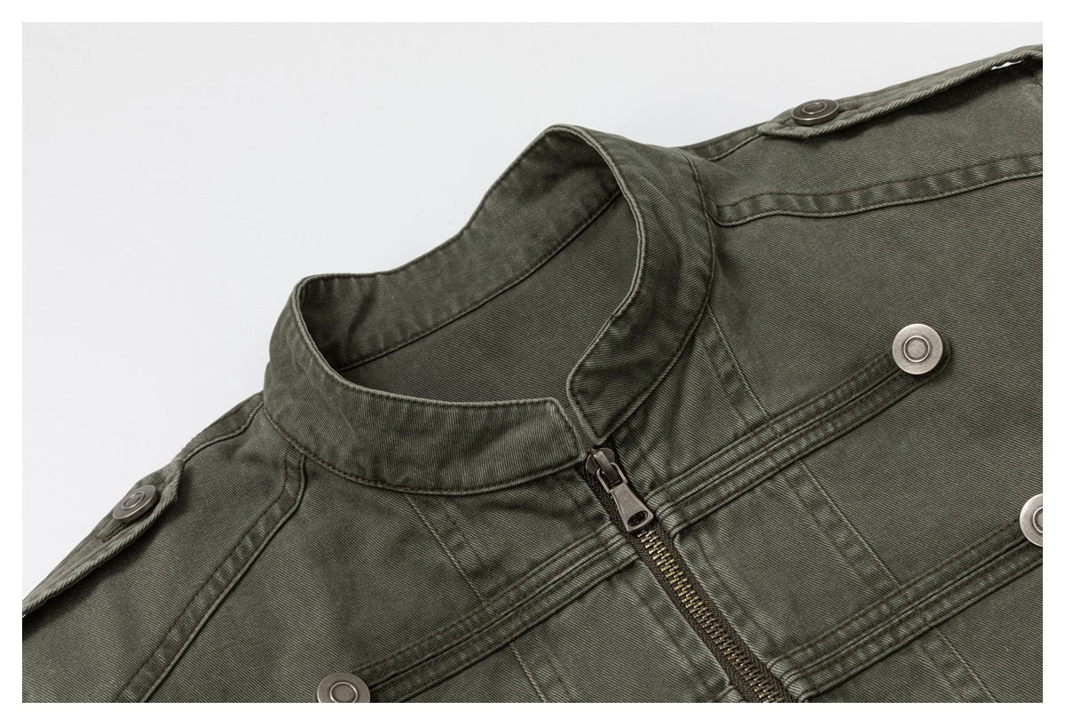 Close-up of an olive-gray jacket collar, front zipper, stitched panels, and metal buttons.