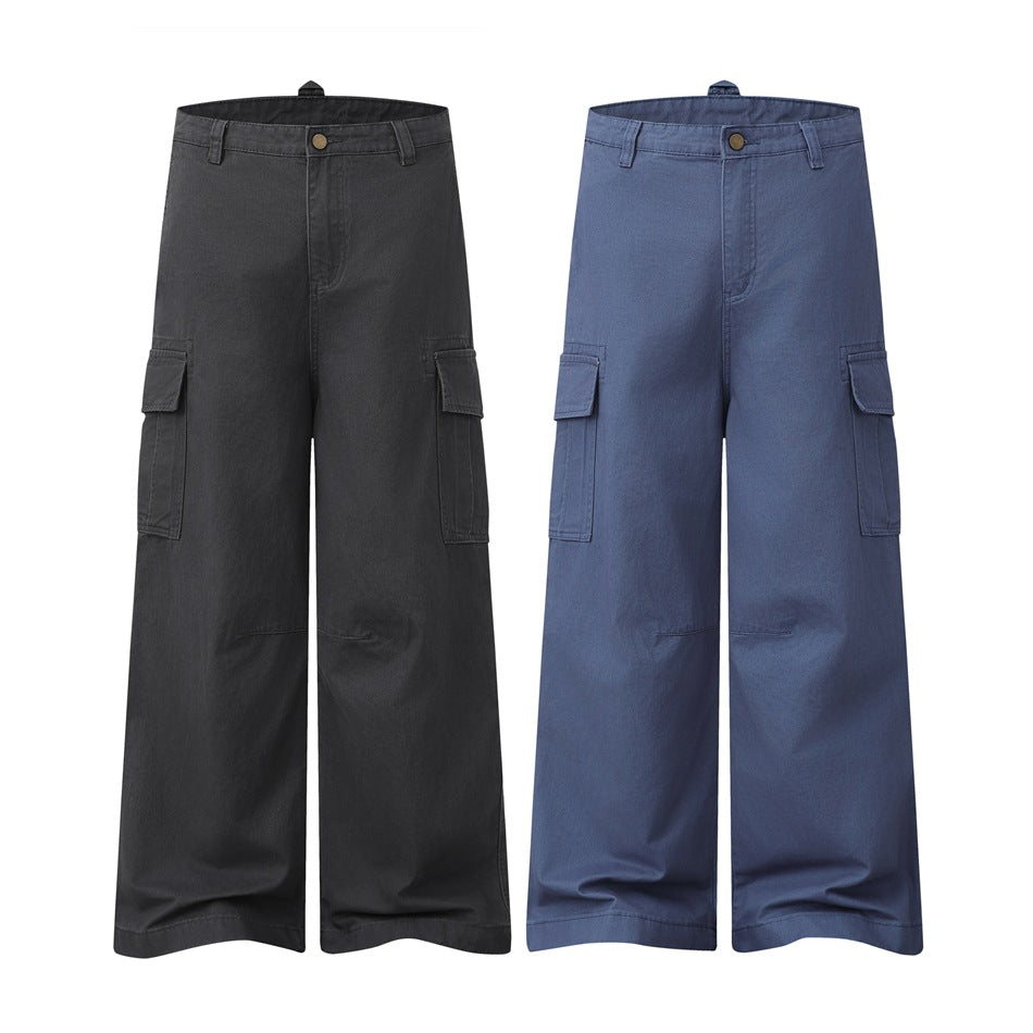 Front views of wide-leg cargo pants in charcoal black and muted blue, each with flap side pockets.