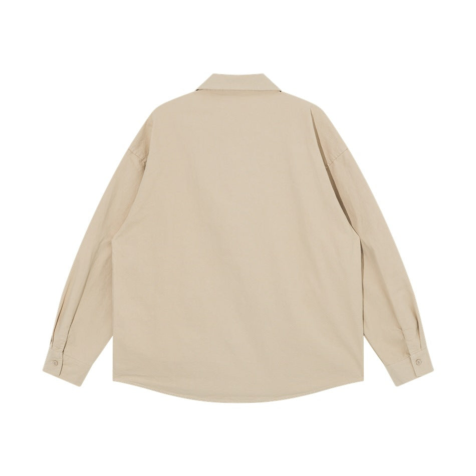 Back view of a plain beige long-sleeve button-up shirt with a pointed collar and curved hem.