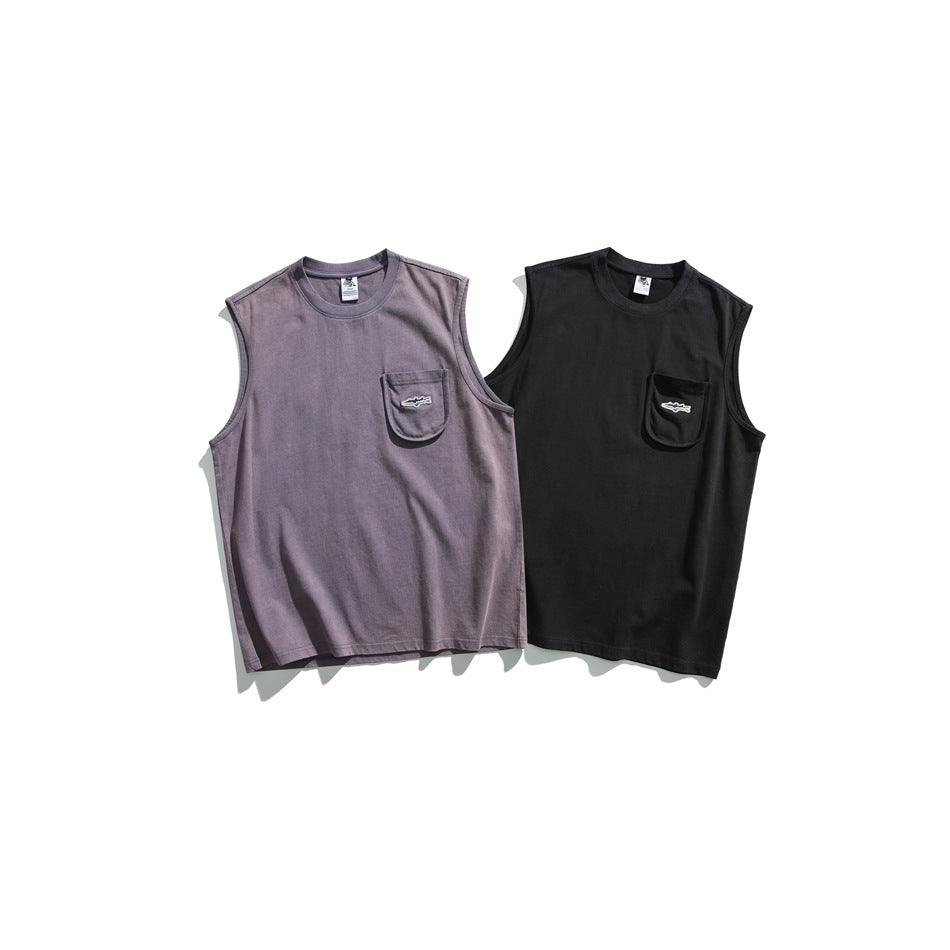 Two sleeveless pocket shirts laid flat: one muted purple and one black.