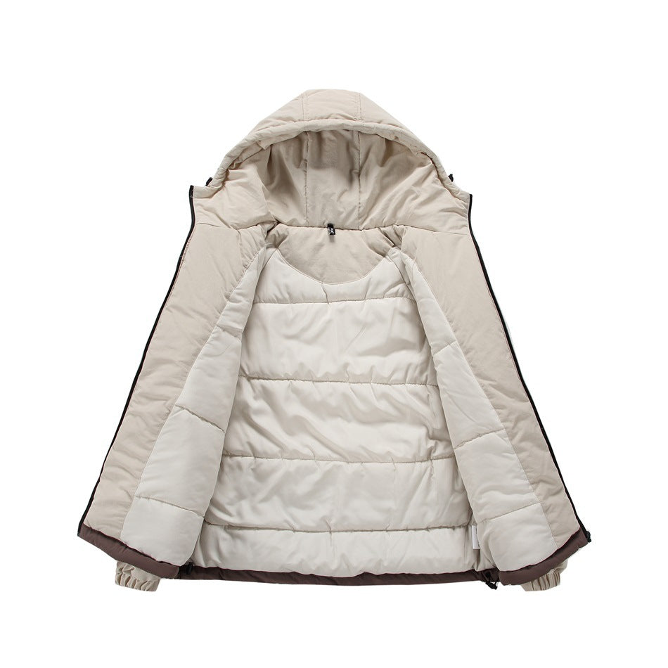 The cream hooded jacket is opened to show its light-colored quilted lining and interior hood.