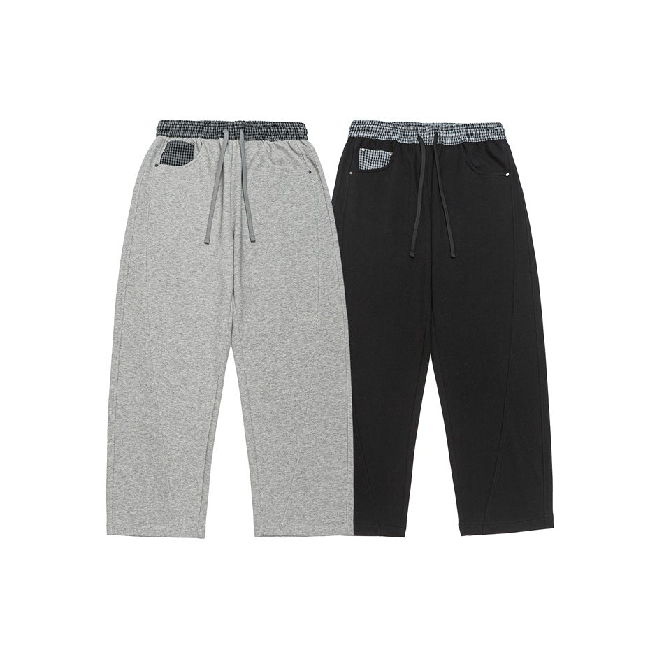 Light gray and black wide-leg pants shown side by side, with checked waistbands and pocket trim.