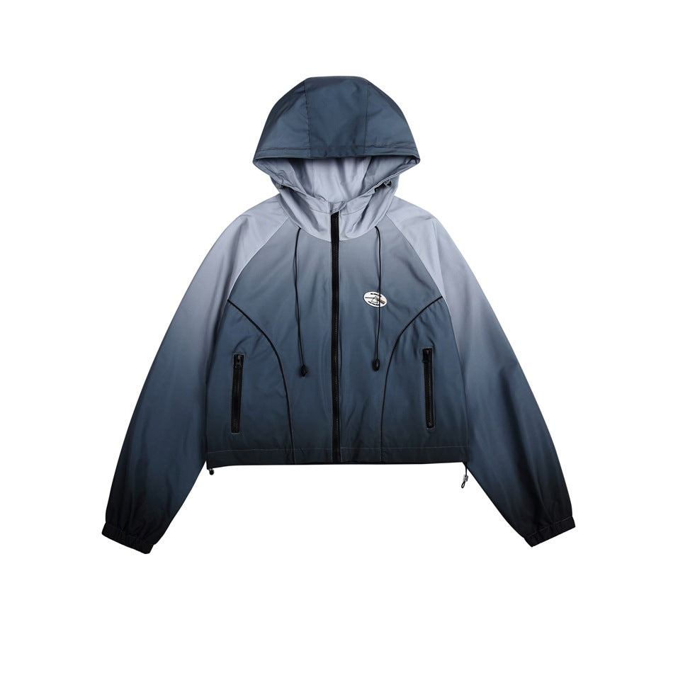 Gray-blue gradient cropped hooded zip jacket, flat front view with black zipper and drawcords