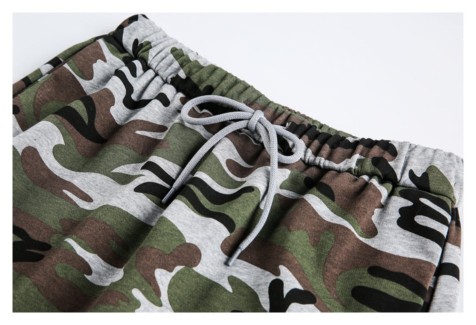 Close-up of the camouflage pants’ gathered elastic waistband and light gray drawstring.