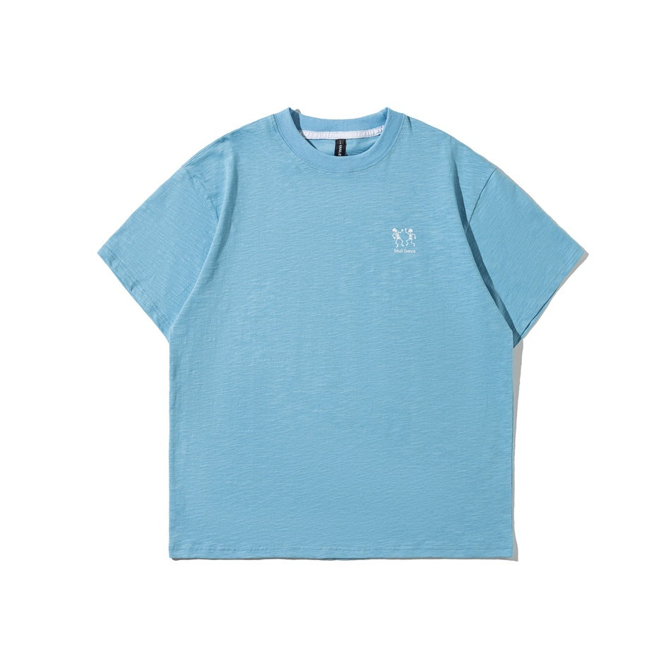 Light blue short-sleeve crew neck T-shirt, front view, with a small white skeleton graphic on the chest