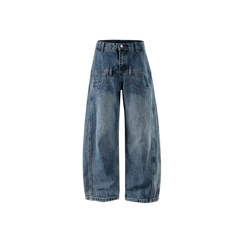 Front view of washed blue wide-leg barrel jeans with button fly and curved front pockets