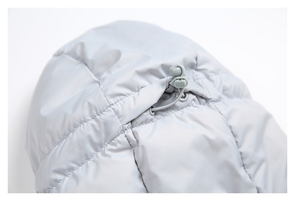 Close-up of a pale gray jacket hood with an adjustable elastic cord and toggle.