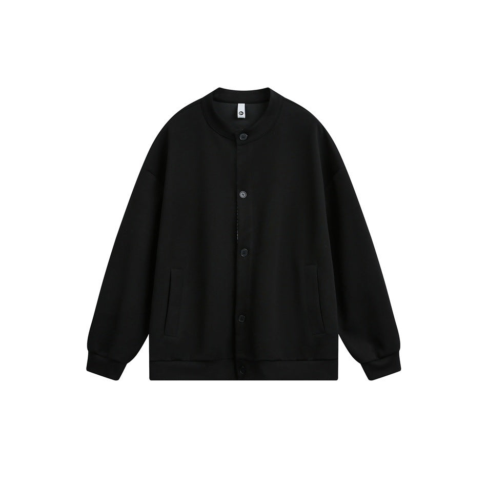 Black button-front jacket with stand collar, side pockets and ribbed cuffs and hem, flat lay front view