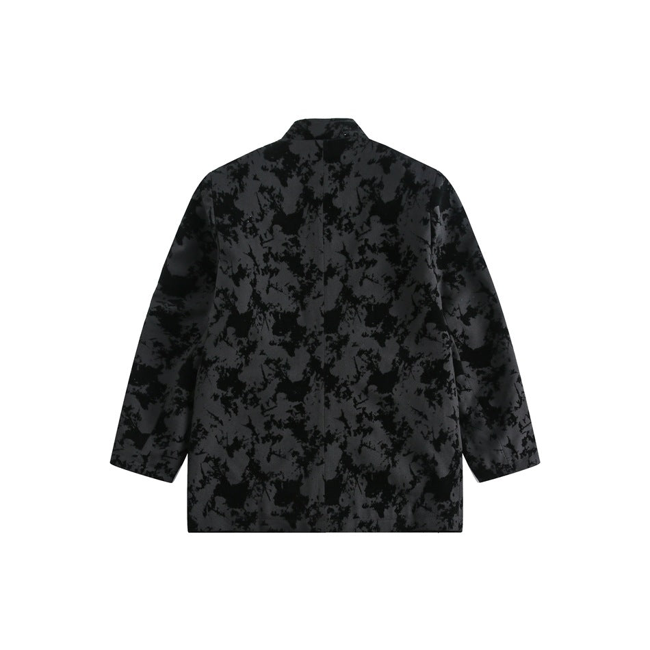 Rear view of a charcoal jacket with a black abstract pattern, long sleeves, and a short stand collar.