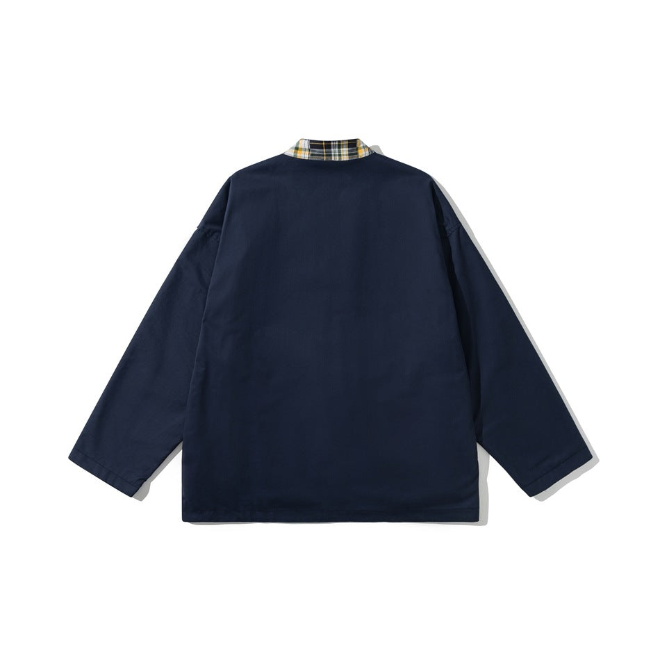 Back view of navy jacket with plain back and plaid inner collar visible at the neckline
