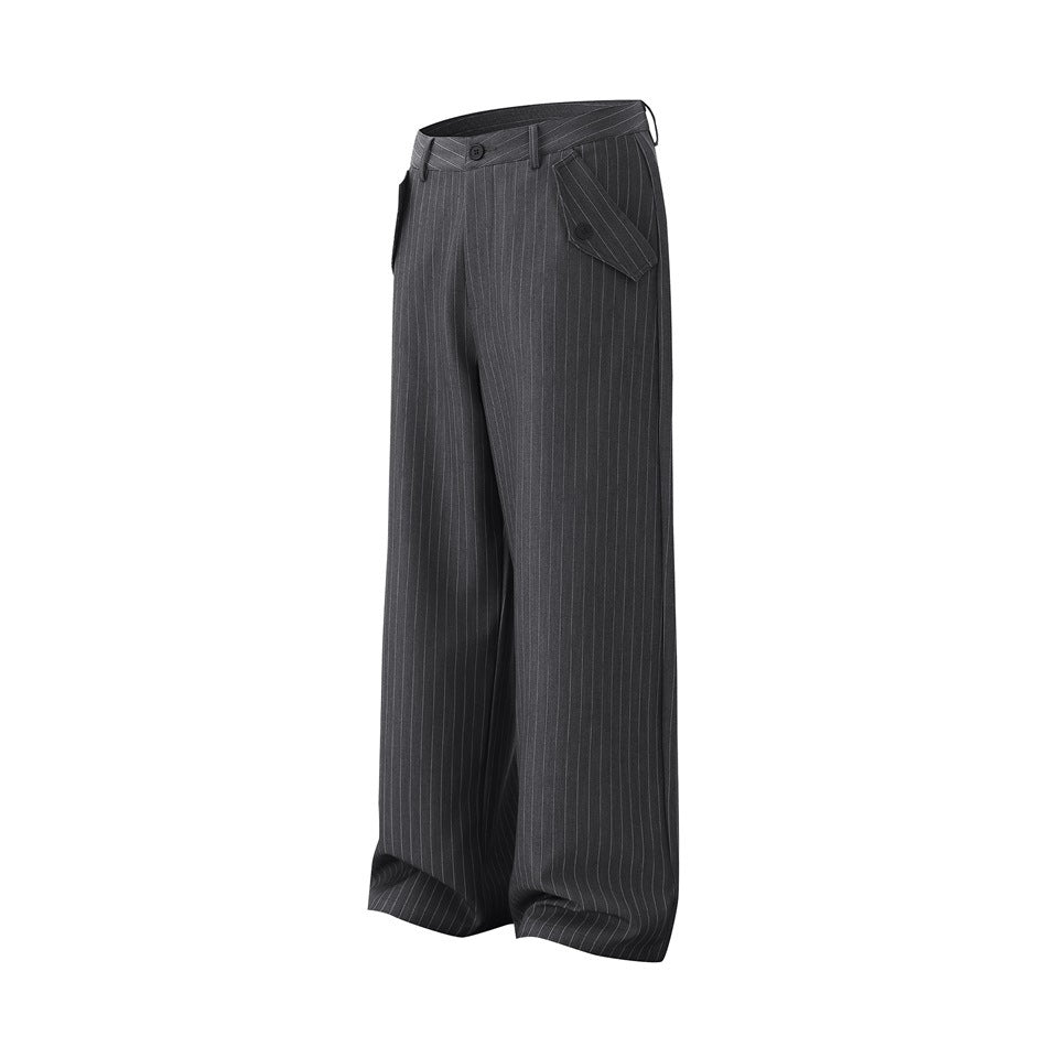 Gray pinstripe wide-leg trousers, angled side view showing flap pocket with button and waistband