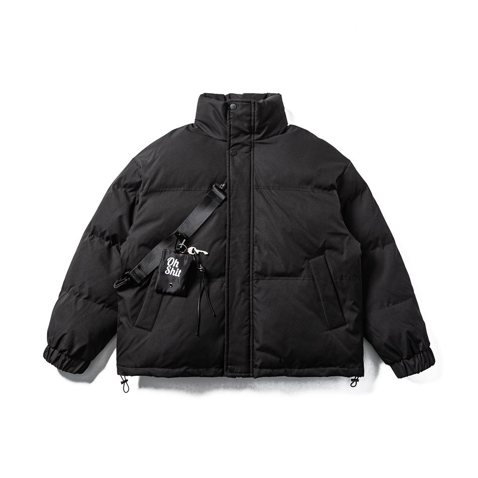Black stand-collar puffer jacket flat lay with diagonal strap and small pouch charm on the front