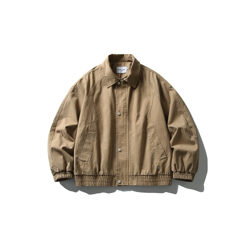 Khaki collared snap-front jacket with raglan sleeves, slanted pockets and elastic hem, flat lay front view