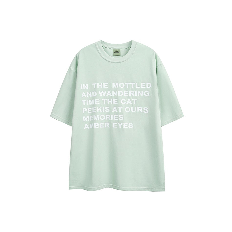 Front view of a pale mint oversized crew-neck T-shirt with white block text across the chest.