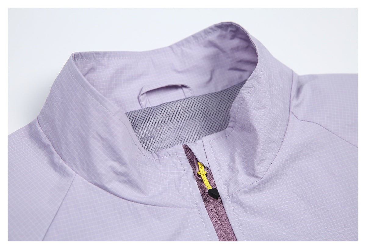 Close-up of the pale lavender jacket collar, mesh lining, and zipper with a yellow pull cord.
