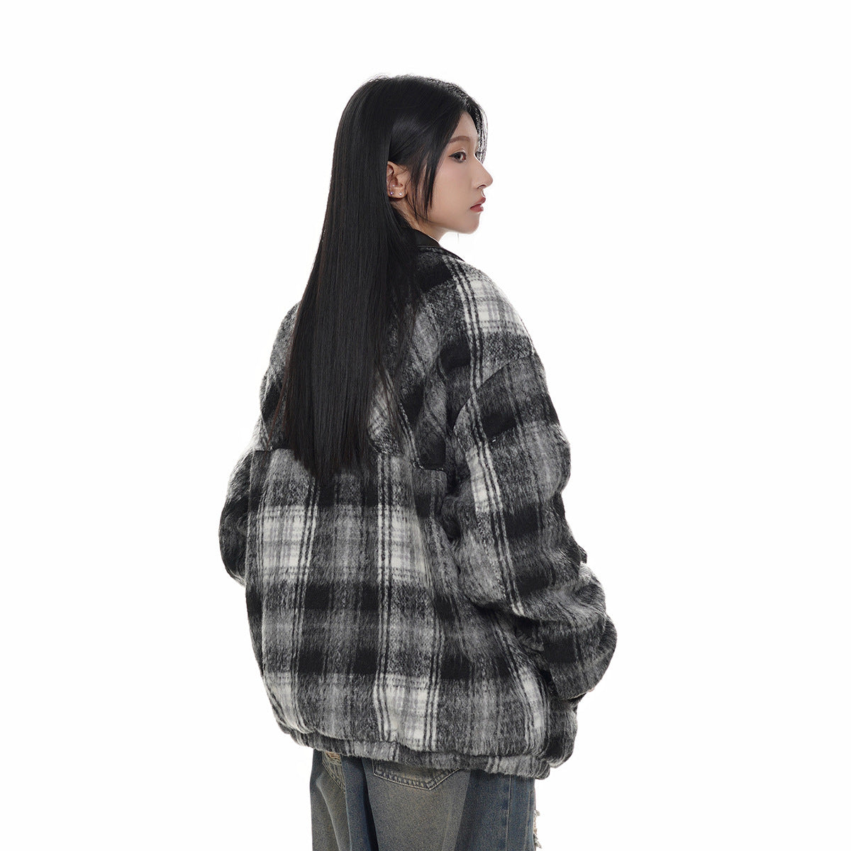 Model shown from behind wearing an oversized black, gray, and white plaid jacket.