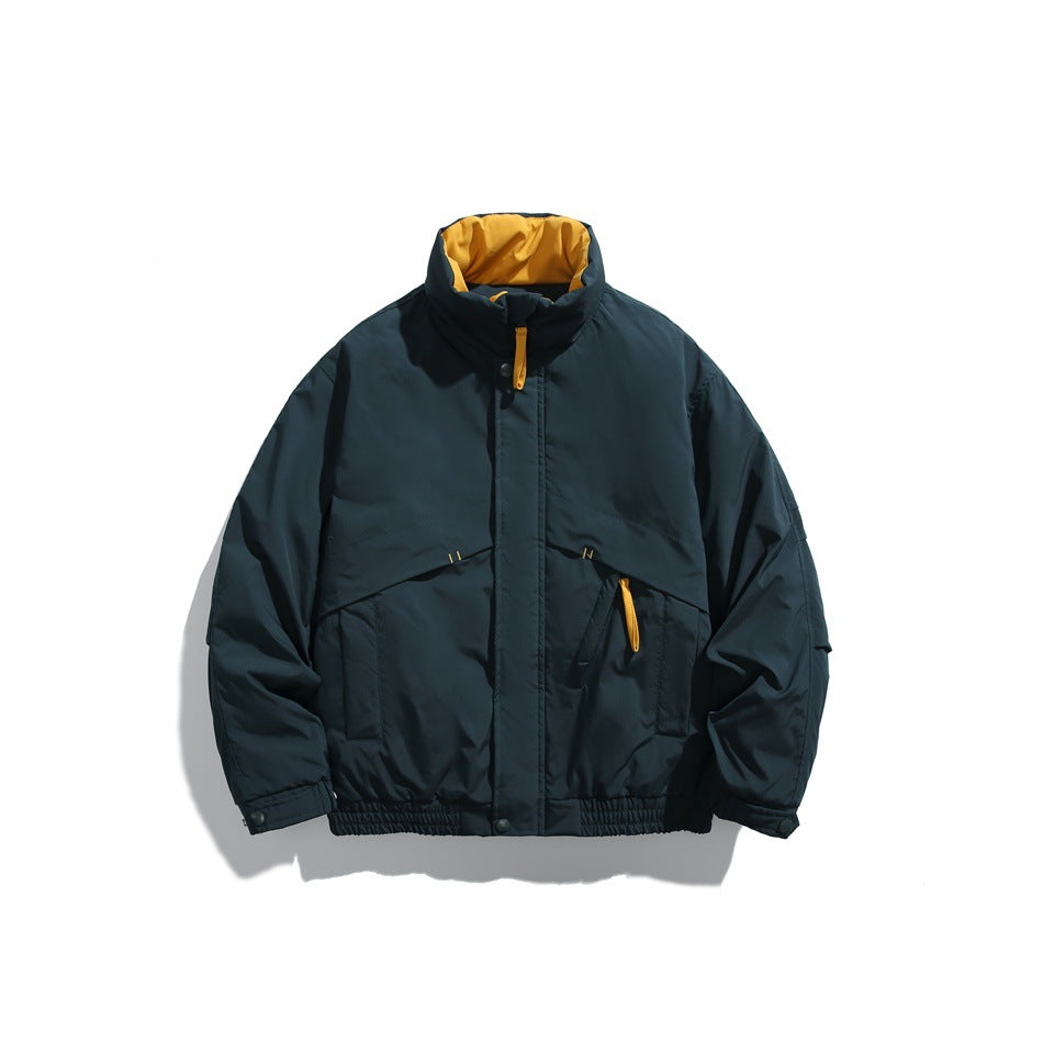 Dark green padded stand-collar jacket flat lay with yellow collar lining and yellow pull tabs