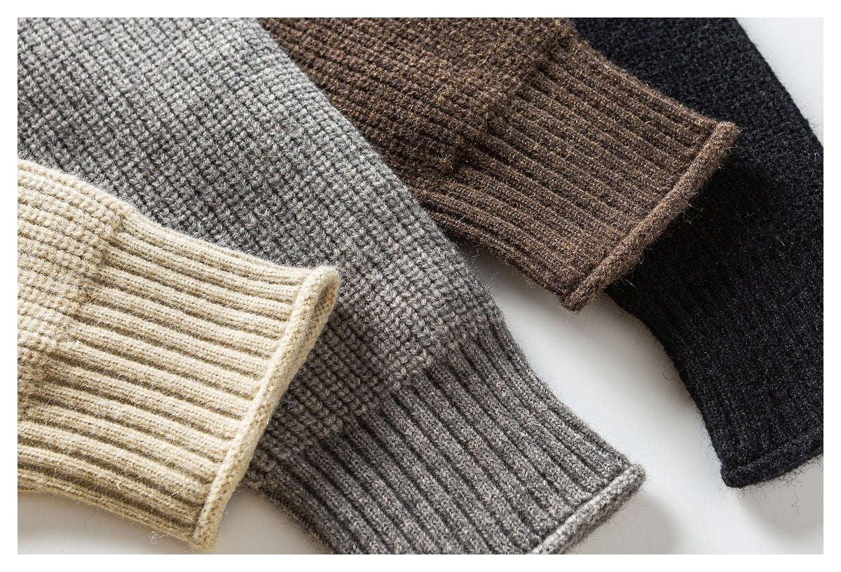 Close-up of sweater cuffs and knit texture in cream, gray, brown and black colorways.