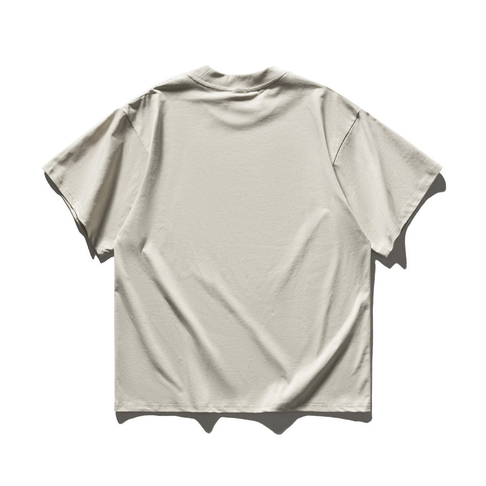 Back view of a light beige short-sleeve crew-neck T-shirt displayed against a white background.