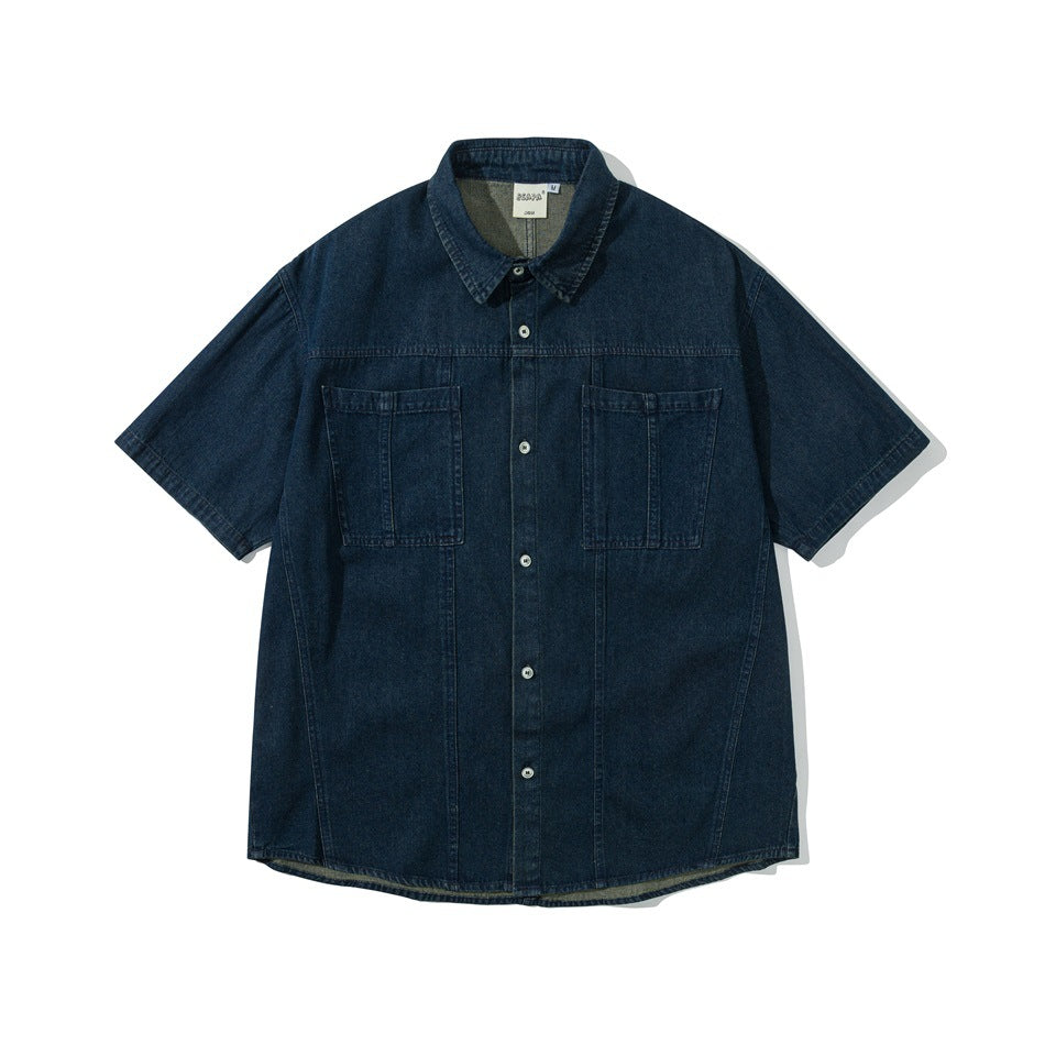 Dark blue short-sleeve denim button-up shirt with two chest pockets, flat lay front view