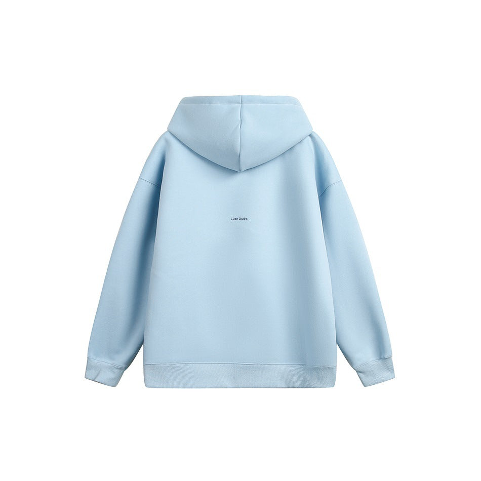 Back view of a pale blue pullover hoodie with a small centered “Cute Dude” print.