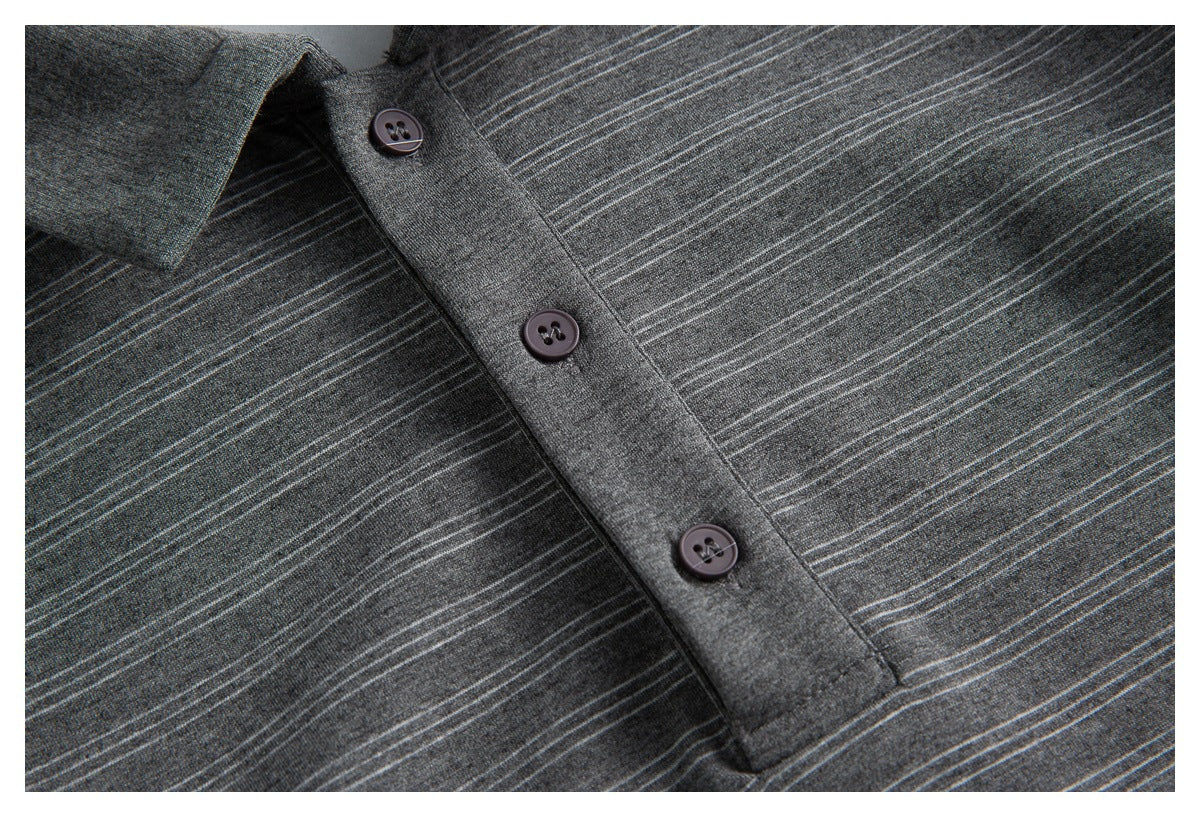 Close-up of a charcoal gray shirt with fine light stripes and a three-button placket.