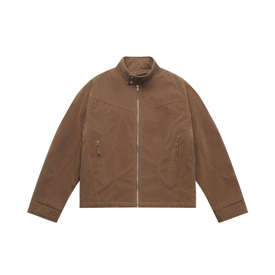 Brown stand-collar zip-front jacket with suede-like finish, paneled seams and zippered pockets, flat lay
