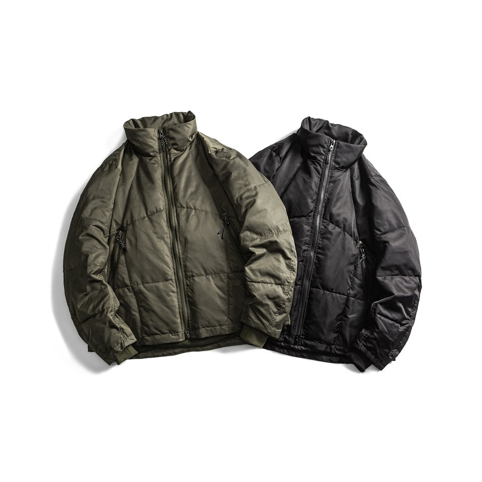 Two high-collar zip-front quilted jackets shown flat, one olive and one black, with zippered pockets.