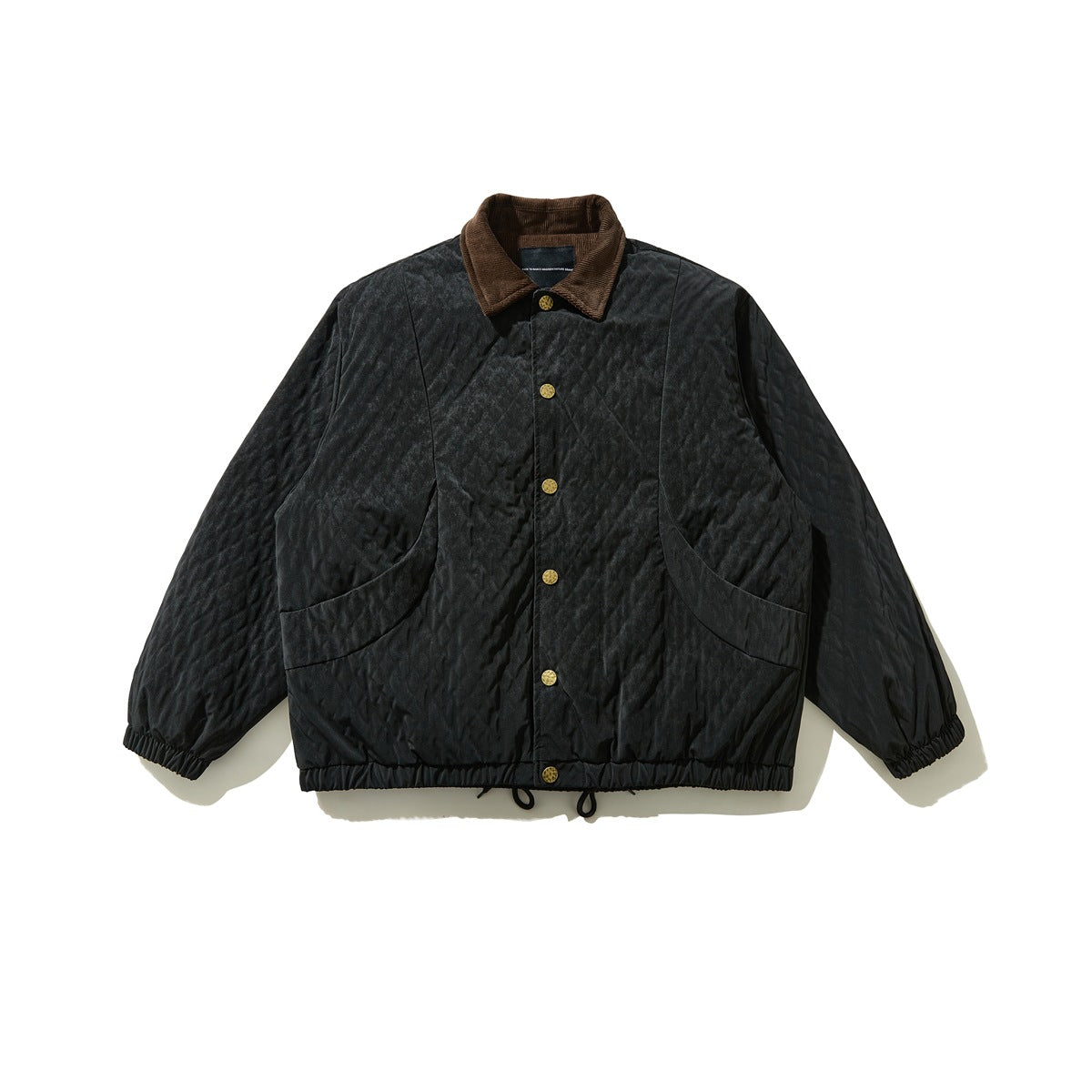 Black quilted jacket with brown corduroy collar, gold snap buttons, curved pockets and elastic hem, flat front view