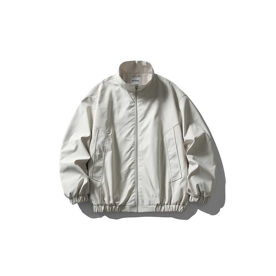 Off-white stand-collar zip jacket with angled front pockets and elastic cuffs and hem, flat front view
