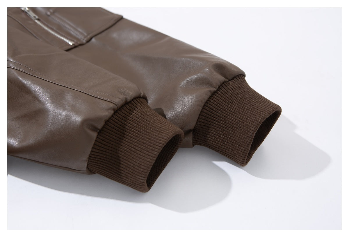 Close-up of taupe-brown jacket sleeves with dark brown ribbed cuffs.