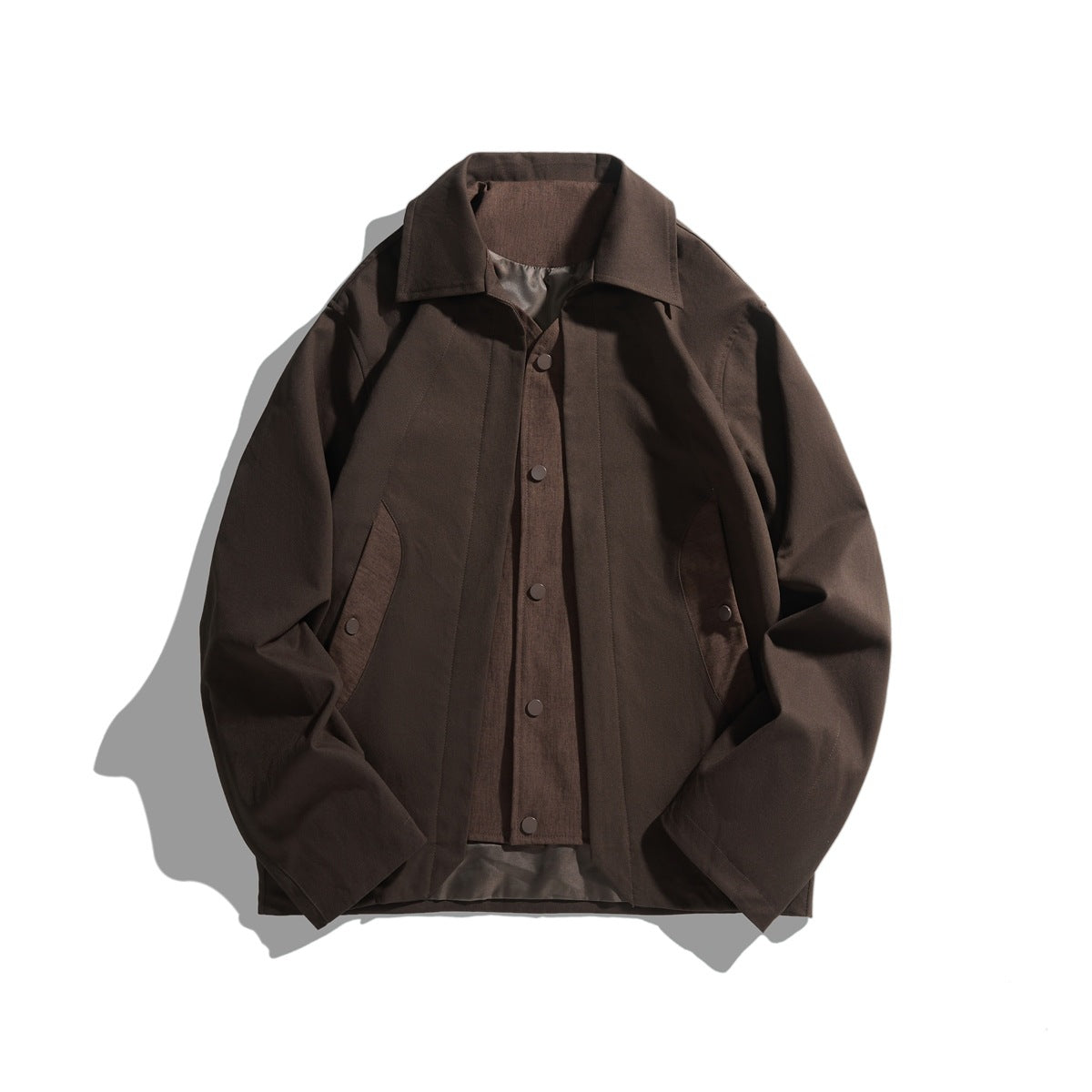 Coffee brown collared jacket flat lay with layered snap-front vest panel and curved side contrast panels