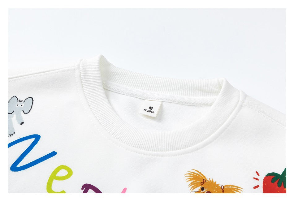 Close-up of a white sweatshirt's ribbed neckline and partial colorful cartoon print.