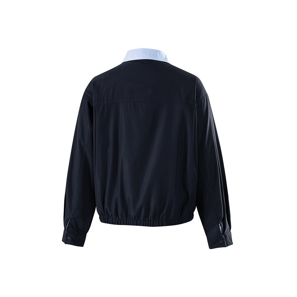 Back view of navy jacket with light blue check collar, back yoke seam, elastic hem and snap cuffs