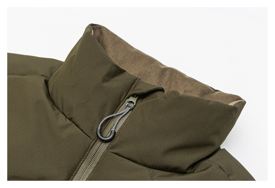 Close-up of the olive jacket's raised collar, zipper, and corded pull.
