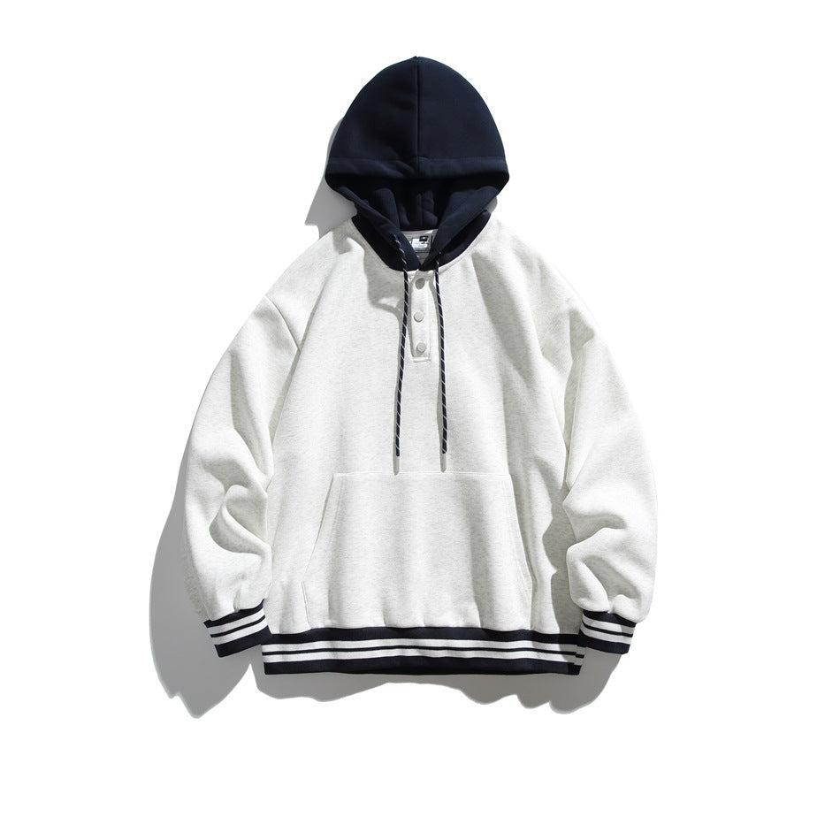 Flat-lay hoodie in light heather gray with navy hood, snap placket, kangaroo pocket and striped navy cuffs