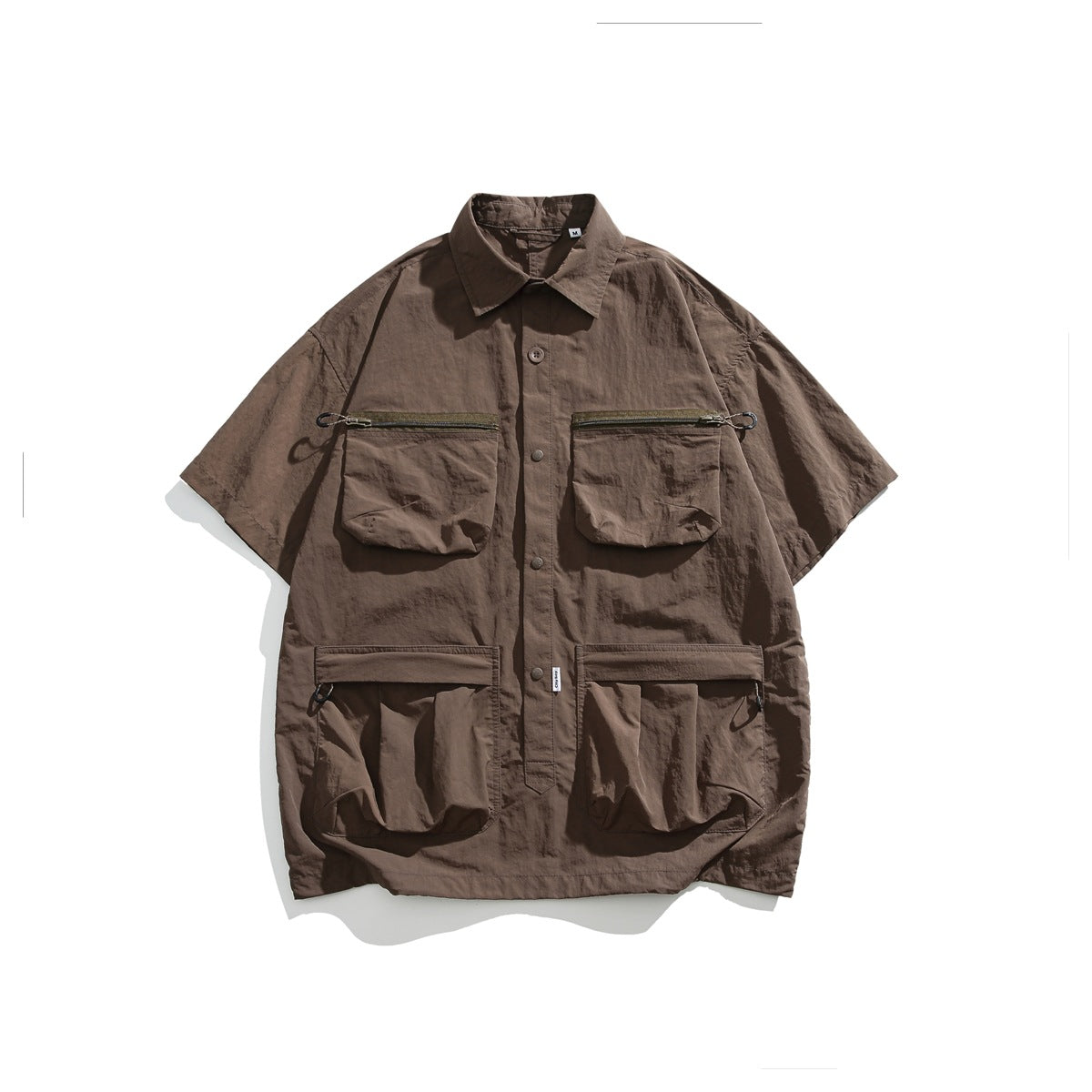 Coffee brown short-sleeve utility shirt flat lay with zip chest pockets and large lower pockets