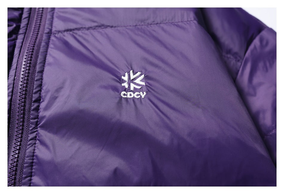 Close-up of a white embroidered logo on the chest of a purple jacket.