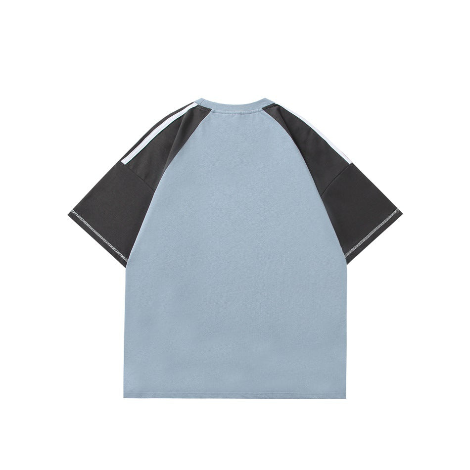 Back view of a light blue T-shirt with charcoal raglan sleeves and narrow white shoulder stripes.
