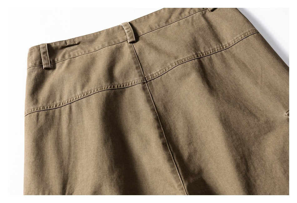 Partial back view of khaki-brown trousers showing the waistband, belt loops, and seat seams.