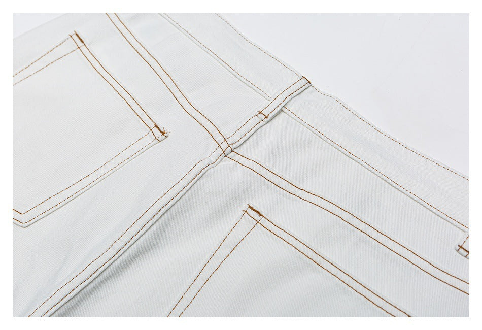 Close-up of a rear patch pocket, waistband, belt loop, and tan contrast stitching.