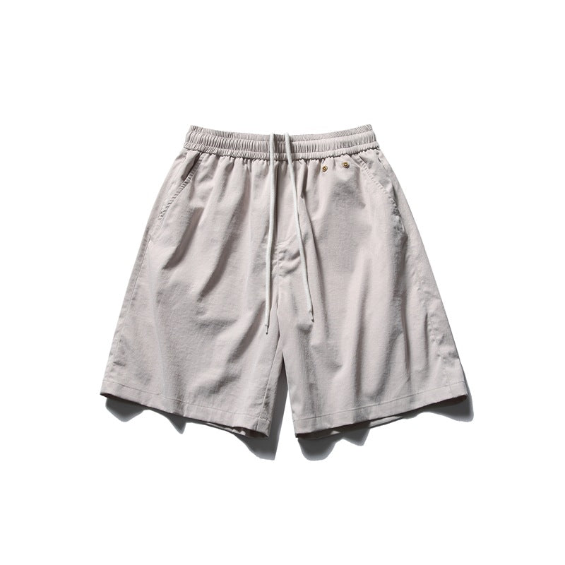 Light beige knee-length shorts with elastic drawstring waist and side pockets, flat lay front view