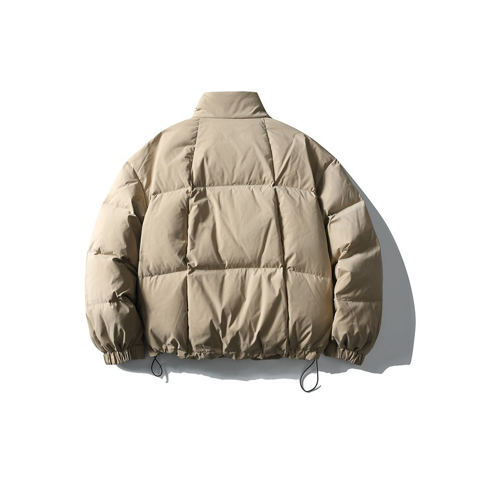 Back view of a taupe quilted puffer jacket laid flat, with a tall collar, elastic cuffs, and hem drawcords.