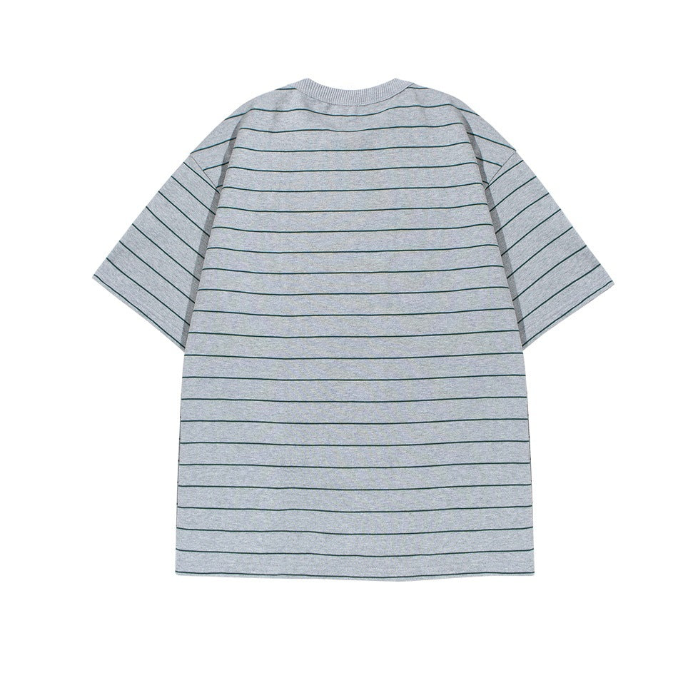 Back view of a gray oversized T-shirt with thin dark green stripes and short sleeves, laid flat.