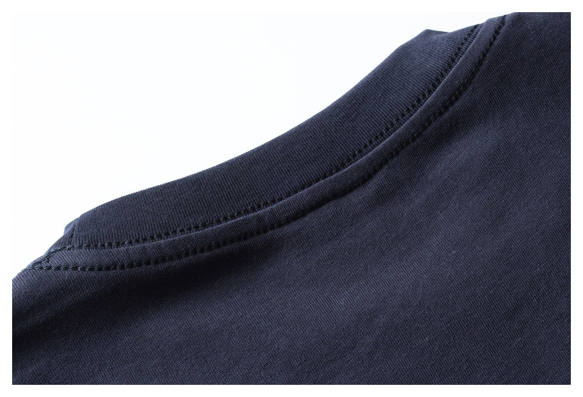 Close-up of a navy garment's ribbed crew neckline and stitched seam against a white background.