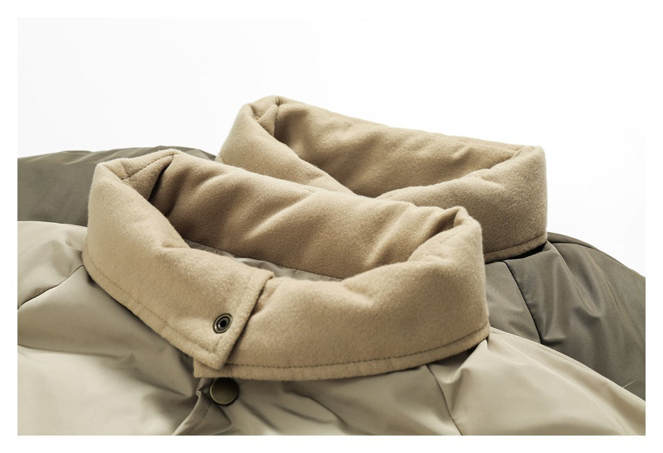 Close-up of the jacket's wide tan collar, snap fastening, and contrasting taupe and beige panels.