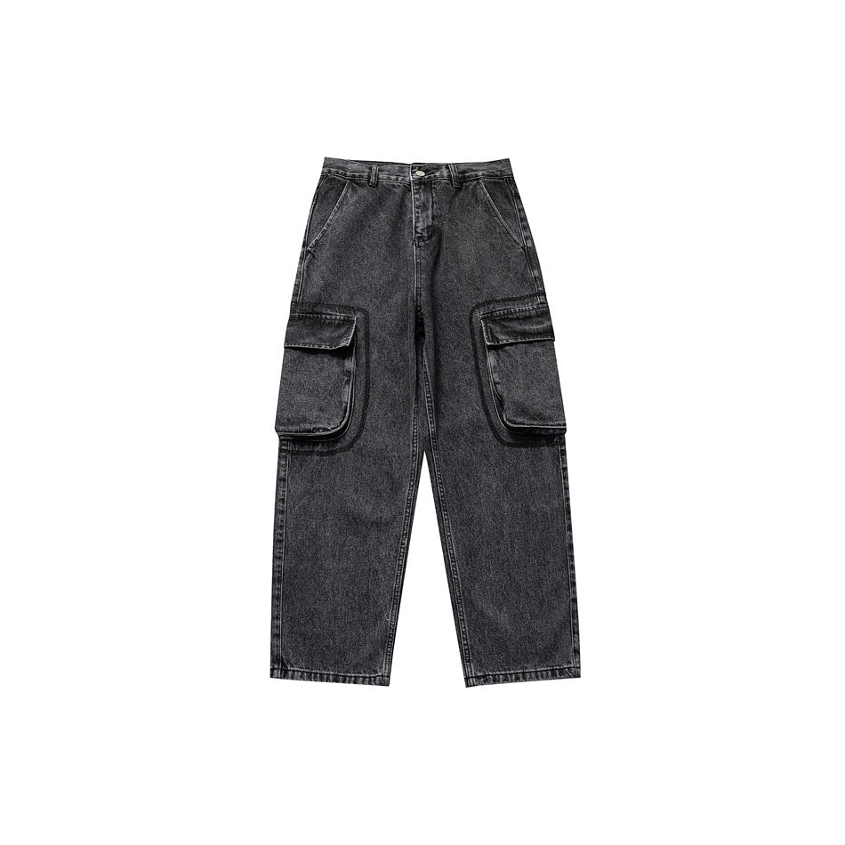 Front view of black washed denim cargo jeans with large flap leg pockets and a wide straight leg