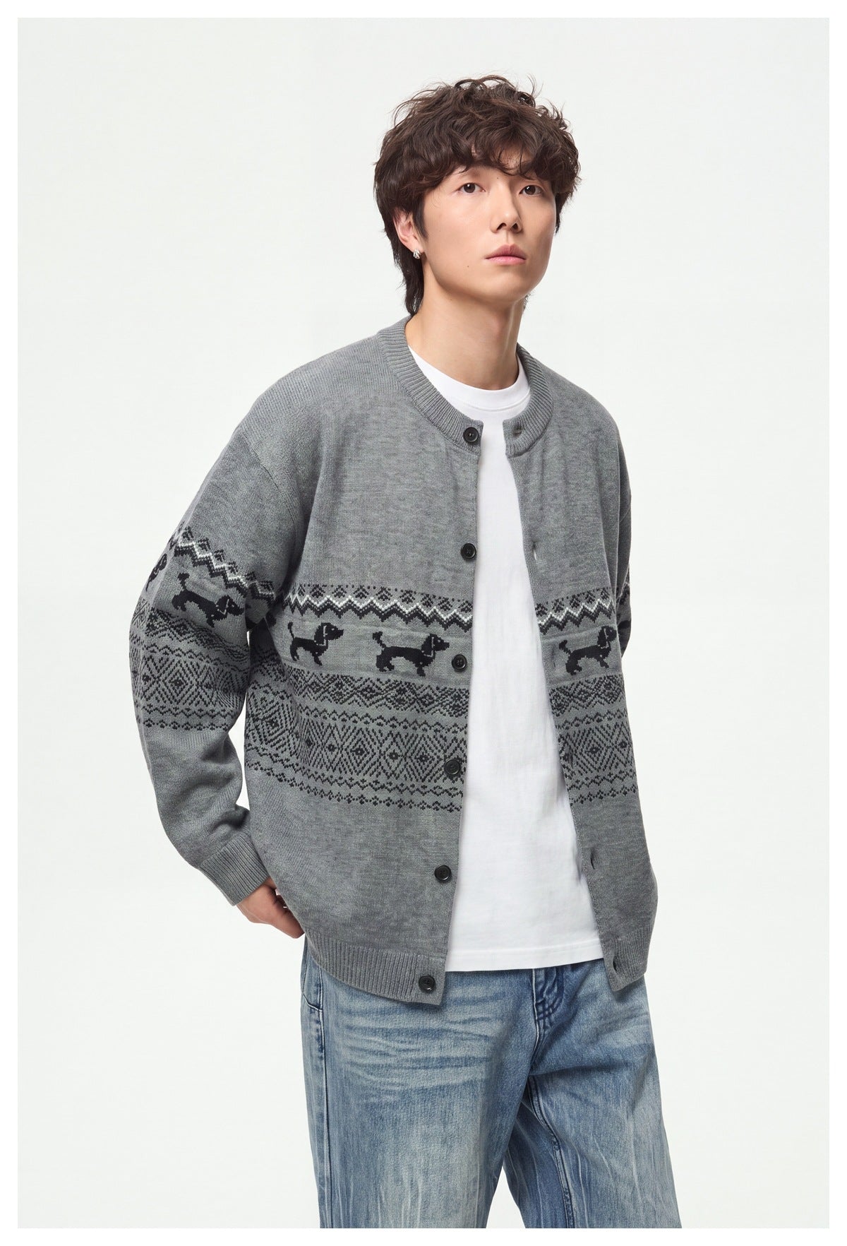 Model wearing a gray button-front cardigan with black dog motifs and geometric bands, shown from head to hips.