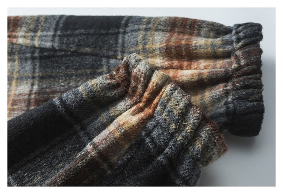 Close-up of the jacket's plaid sleeve and gathered elastic cuff.