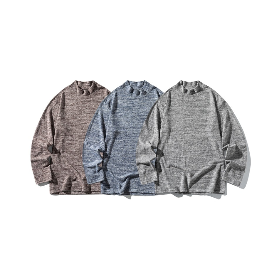 Three long-sleeve marled tops arranged side by side in taupe, blue, and gray.